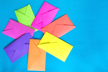 Colorful envelopes on the blue background.