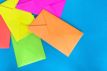 Colorful envelopes on the blue background.
