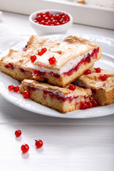 Red currant fruit pie bars with meringue on top.
