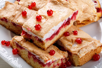 Red currant fruit pie bars with meringue on top.