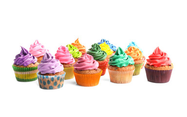 Tasty colorful cupcakes on white background
