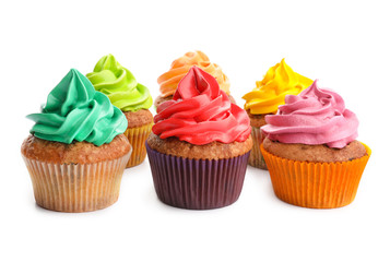Tasty colorful cupcakes on white background