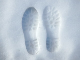 Human footprint in white snow