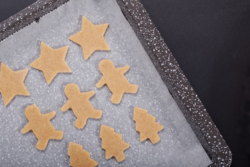 Baking concept Homemade organic Butter sugar Cookies dough on round wooden board and cookie cutter various shape with copy space