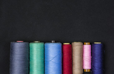 Place to enter additional text over spools of thread.