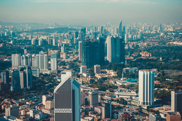 Modern architecture, business office building, cityscape background. Kuala Lumpur skyline. Travel to Malaysia. Urban skyscrapers. Modern city. Financial district. City tour. Birds eye view of downtown