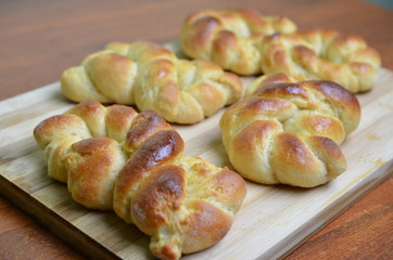 A fresh baked golden batch of braided challah bread