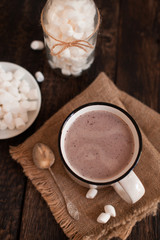 Fototapeta na wymiar Mug of hot chocolate or cocoa with marsmallow
