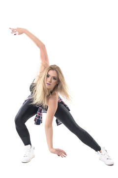 Blonde bent female jazz dancer performance with arms swinging in s curved position. Full body length portrait isolated on white studio background.