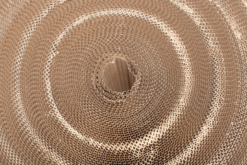 Fototapeta na wymiar Circular coil of corrugated cardboard. Top view.