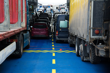 Naklejka premium Cars and trucks on the ferry 
