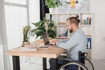 disabled man using laptop