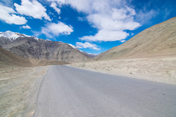 On the road in Leh Ladakh landscape.Khardung La pass.Road on snow mountain  in northern India.