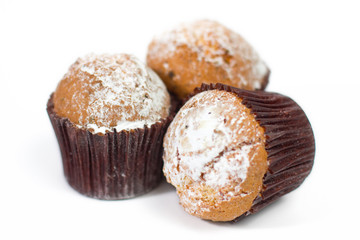 Fresh homemade delicious muffins with sugar powder