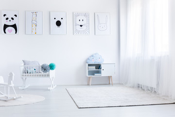 Fototapeta premium Baby's bedroom with white furniture