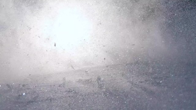 Skier running downhill on piste, slow motion