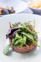 tasty Steak tartare (Raw beef) - classic steak tartare on white plate