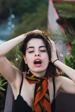 Sexual model posing on balcony
