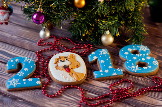 Holiday cookies in shape of 2018 new year on wooden background