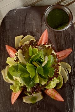 Salad of greens leaves and artichoke