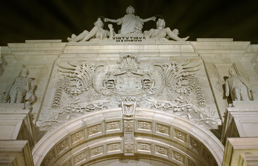 Triumphal Rua Augusta Arch in Lisbon at night.