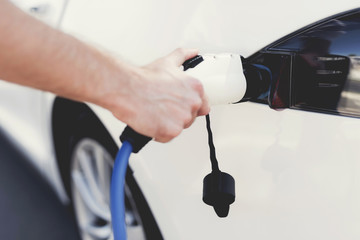 The electric machine stopped at the charging station to recharge.