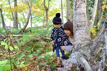 young japanese mother is playing with her son