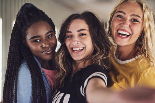 Diverse Group Of Young Female Friends Taking A Selfie Together