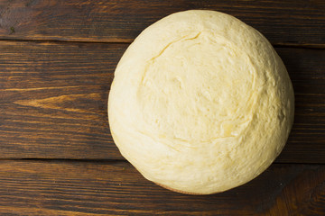 dough with close-up. man is preparing bread dough