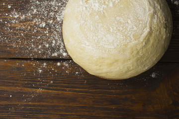 dough with close-up. man is preparing bread dough