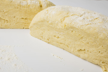 dough with close-up. man is preparing bread dough