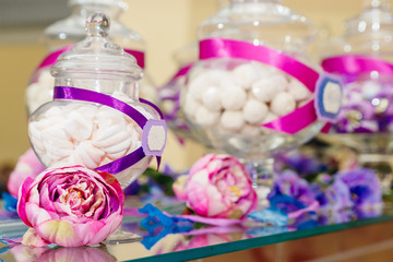 Dessert table at kids birthday party. Cake, candies, marshmallows, cakepops and other sweets