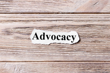 advocacy of the word on paper. concept. Words of advocacy on a wooden background