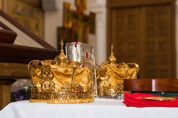 Fototapeta na wymiar two wedding crowns in the church