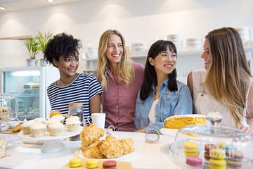 Young women smiling in bakery