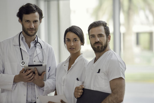 Portrait of healthcare professionals standing in hospital - Powered by Adobe