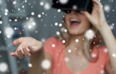 happy woman in virtual reality headset or glasses