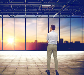 businessman thinking over office and city view