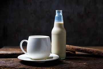 Bottles of milk and glass of milk