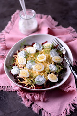 Healthy salad from boiled beetroot, hard cheese, quail eggs and dressings from natural yogurt with dill, black pepper and sea salt.