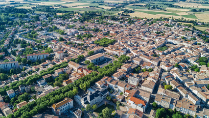 Aerial top view of residential area houses roofs and streets from above, old medieval town background, France
