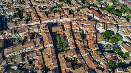 Fototapeta premium Aerial top view of residential area houses roofs and streets from above, old medieval town background, France 