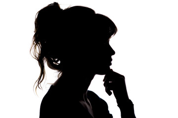 silhouette of a thoughtful beautiful girl with hand near her chin thinking about solving a problem on white isolated background