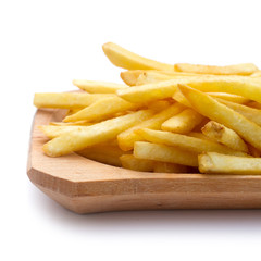 pile of french fries on wooden plate - isolated