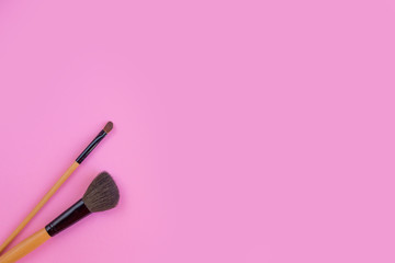 Obraz na płótnie Canvas Brushes for make-up on a pink background