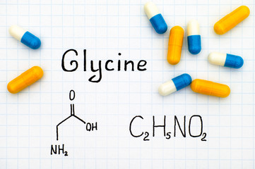 Chemical formula of Glycine with some pills.