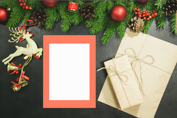 Fototapeta na wymiar Christmas background or Xmas card with decorations fir, gift box and ornamen. Space for Holiday Greetings. Top view. Planning of New Year's holidays