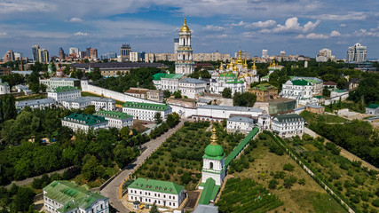 Aerial top view of Kiev Pechersk Lavra churches on hills from above, cityscape of Kyiv city, Ukraine
