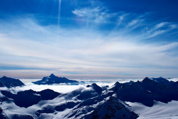 Fototapeta na wymiar beautiful view of clouds crossing the mountain ridge. awesome mountain