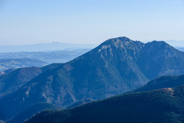 mountain tops in  autumn covered in mist or clouds